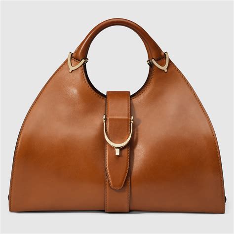 gucci stirrup leather top handle bag|Gucci leather shoulder bag.